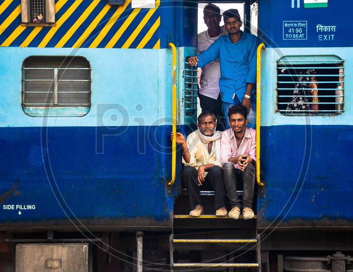 Rail passengers on door of cabin | Indian railway