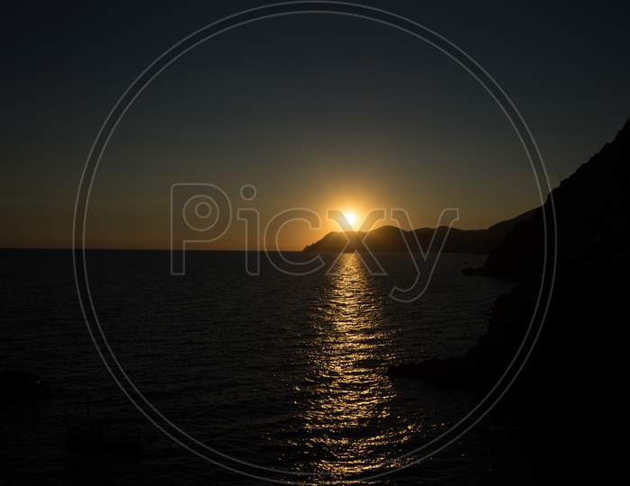 Golden Sunset At The Cliff At The Italian Riviera In The Village Of Riomaggiore, Cinque Terre, Italy