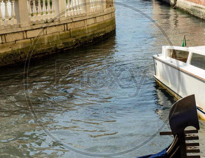 Venice, Italy - 01 July 2018: The Gondolas Parked Near Bridge In Venice, Italy