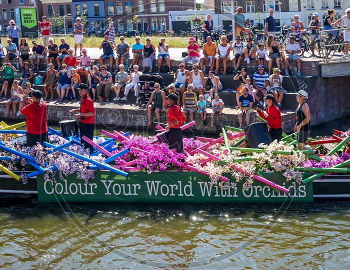 Netherlands,Delft-5 August 2018:Westland Boat Parade (Varend Corso),Festive Spectacle,Boats Decorated With Flowers And Vegetables, Colorful Sailing Flower Parade In The Westland Region