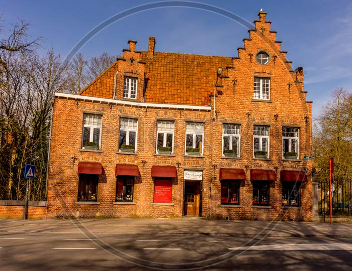 Bruges, Belgium - 17 February 2018: Wine House Chardonnay Being Sold In A Red Brick Building At Bruges