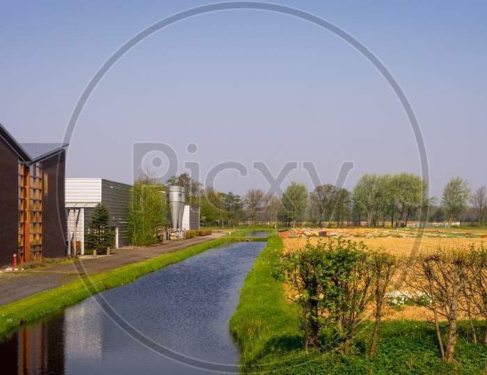 Leiden, Netherlands - 22 April 2018:  An Emptry Farmers Field With A Canal On The Outskirts Of Leiden
