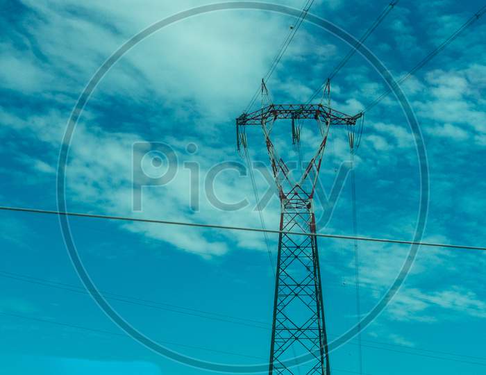 Italy,La Spezia To Kasltelruth Train, A Electric Tower And A Blue Sky