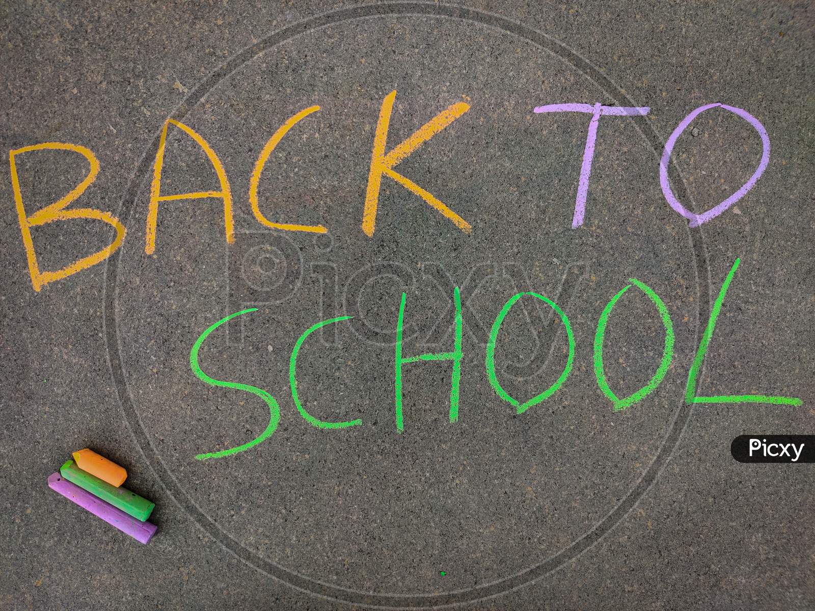The Inscription Text On The Grey Board, Back To School. Using Color Chalk Pieces. Post Corona Concept