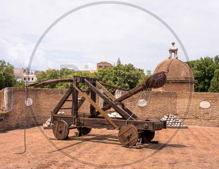 Rome, Italy - 23 June 2018: Ancient Catapult Cannon Weapon With Cannon Balls At The Castel Sant Angelo, Mausoleum Of Hadrian In Rome, Italy