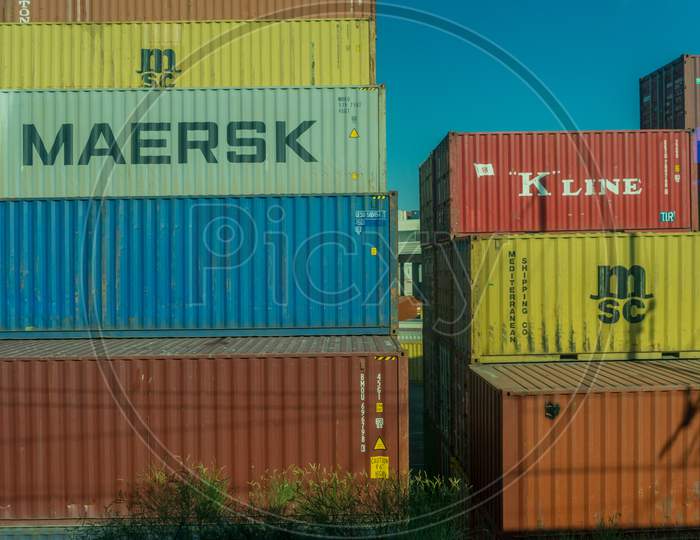 Italy - 28 June 2018: The Yang Ming,K Line, Maersk, Cma Cgm, Cai, Arkas,Triton, Sav,Evergreen Container On A Train In Italy