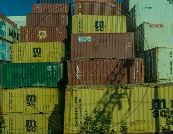 Italy - 28 June 2018: The Yang Ming,K Line, Maersk, Cma Cgm, Cai, Arkas,Triton, Sav,Evergreen Container On A Train In Italy