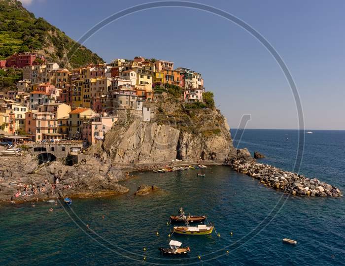 Italy, Cinque Terre, Manarola, Cinque Terre, A Body Of Water With Cinque Terre In The Background