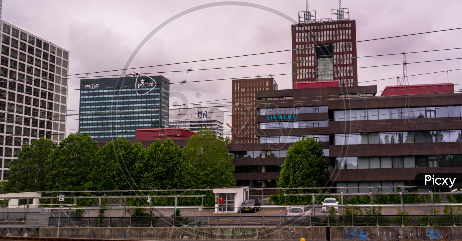 Den Haag, 22 June 2018: The Post Nl And Siemens Building Viewed From Den Haag Central Railway Station