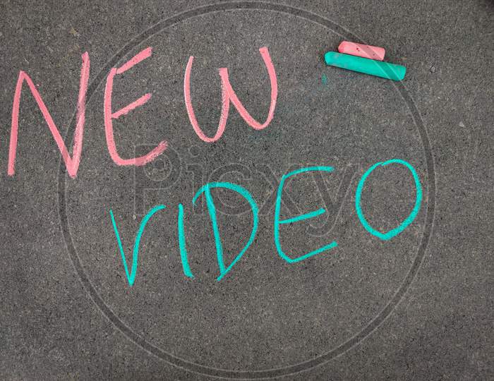 The Inscription Text On The Grey Board,New Video. Using Color Chalk Pieces.