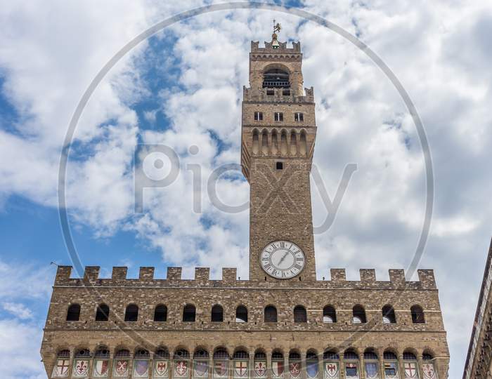 Italy,Florence, Palazzo Vecchio, A Large Tall Tower With A Clock At The Top Of Palazzo Vecchio
