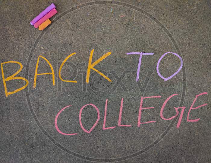 The Inscription Text On The Grey Board, Back To College. Using Color Chalk Pieces. Post Corona Concept