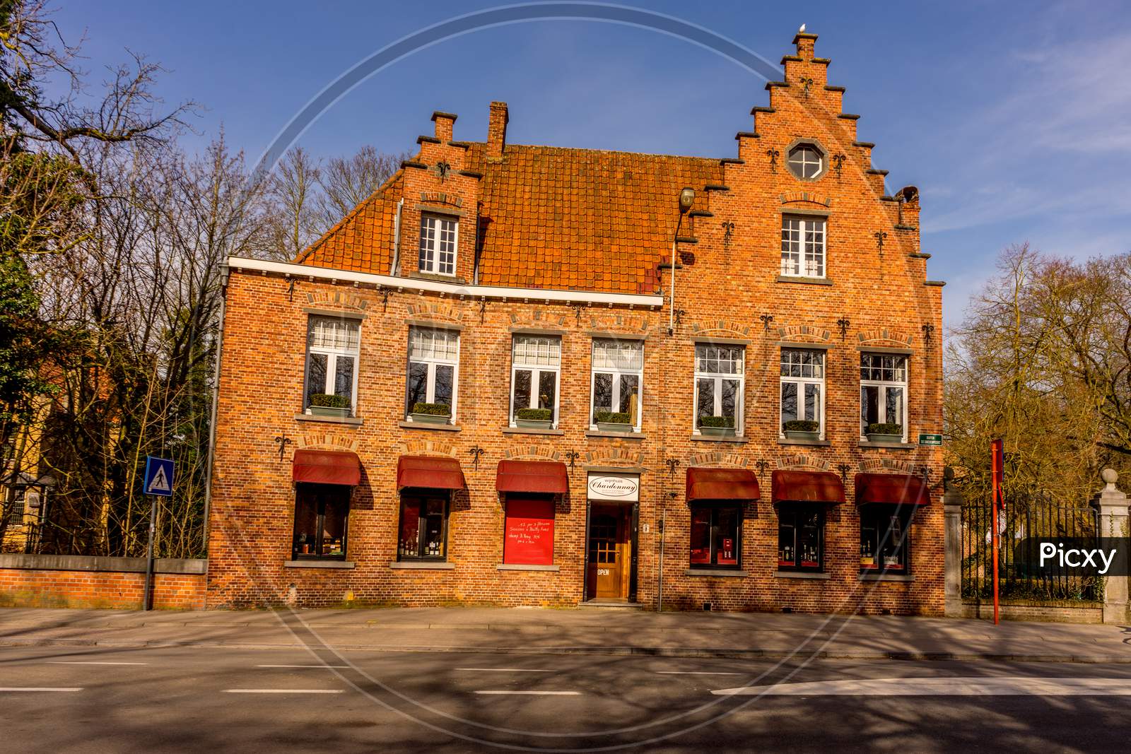 Bruges, Belgium - 17 February 2018: Wine House Chardonnay Being Sold In A Red Brick Building At Bruges