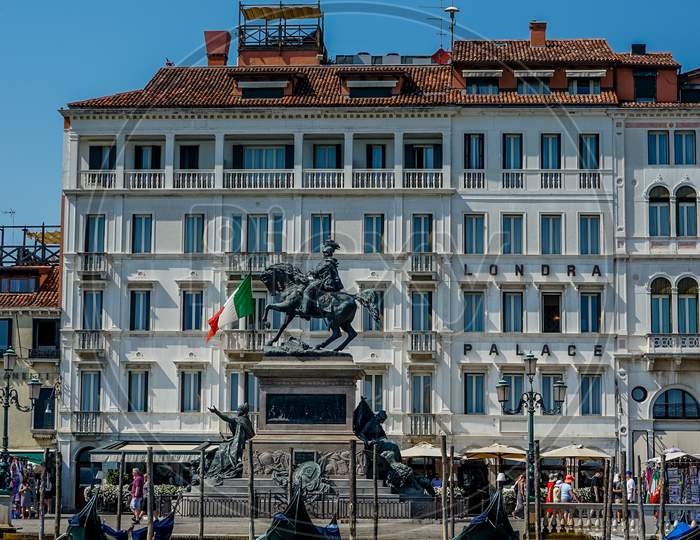 Venice, Italy - 01 July 2018: The Londra Palace  Statue Of Vittorio Emanuele In Venice, Italy