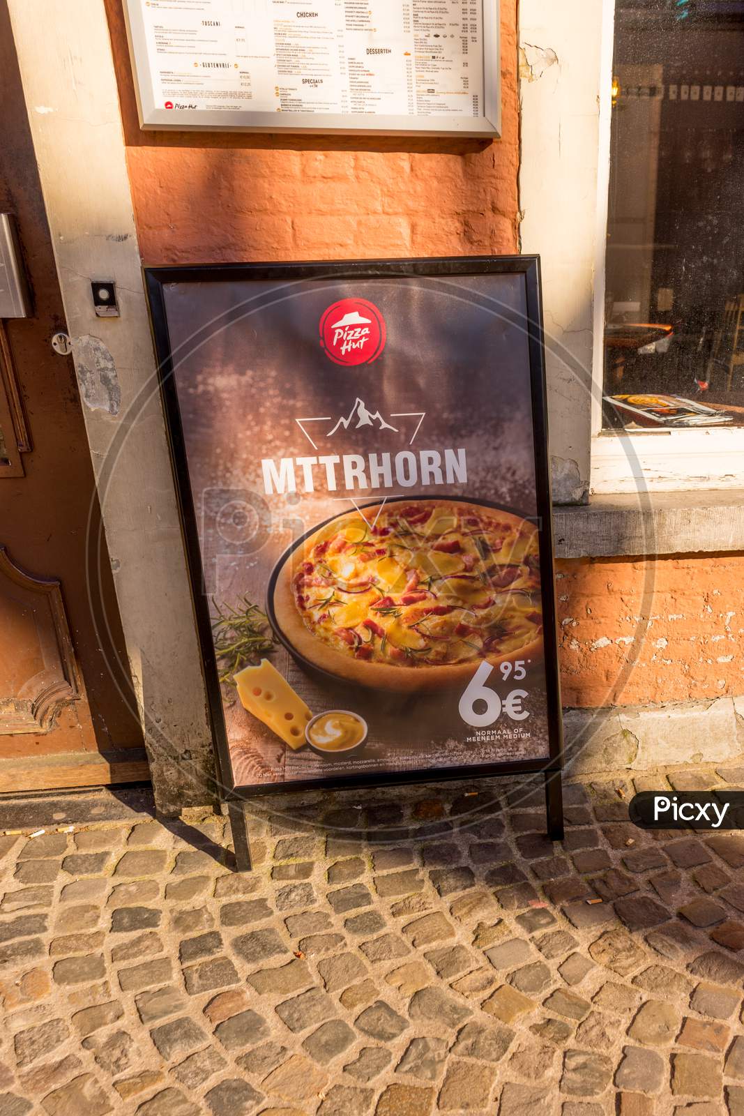 Bruges, Belgium - 17 February 2018: The Matterhorn Pizza Being Sold At Pizza Hut In Bruges, Belgium