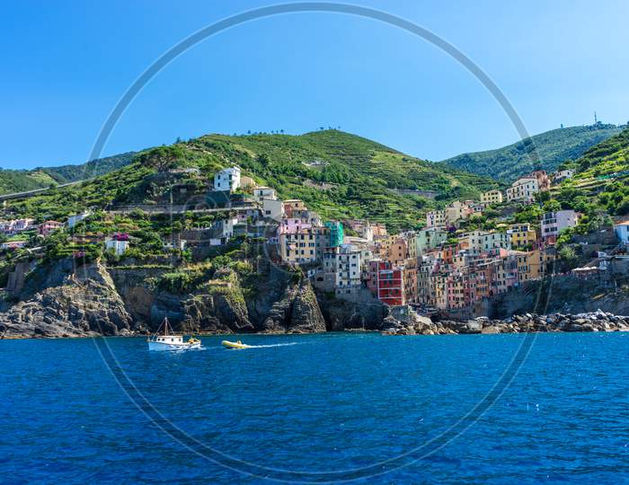 The Cityscape Of Riomaggiore Viewed From The Sea, Cinque Terre, Italy, Riviera