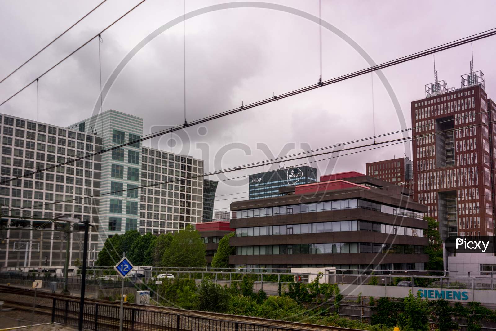 Den Haag, 22 June 2018: The Post Nl And Siemens Building Viewed From Den Haag Central Railway Station