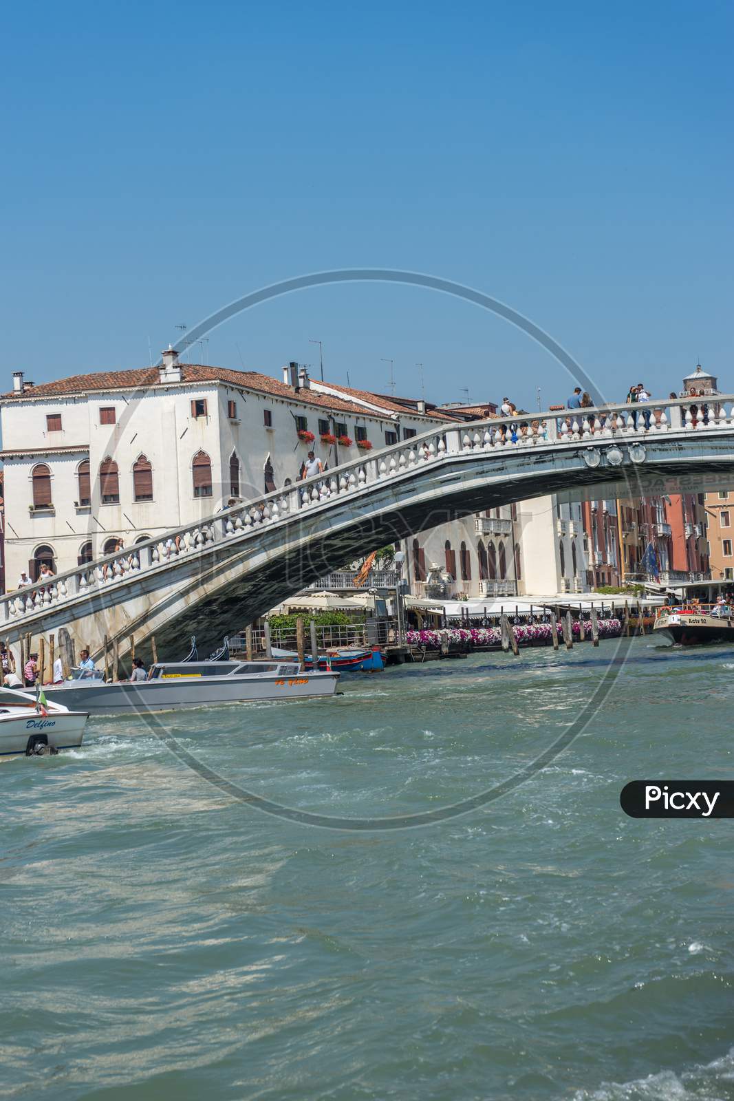 Venice, Italy - 30 June 2018: People Walking On The Bridge Over A Canal In Venice, Italy