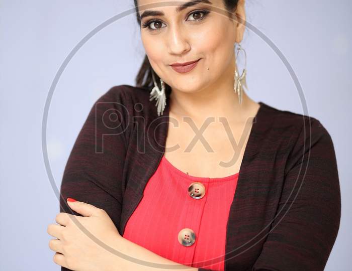 Yong Indian female lady in a office dress wearing with white background