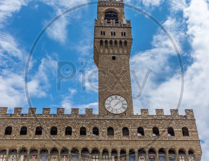 Italy,Florence, Palazzo Vecchio, A Large Clock Tower In Front Of Palazzo Vecchio