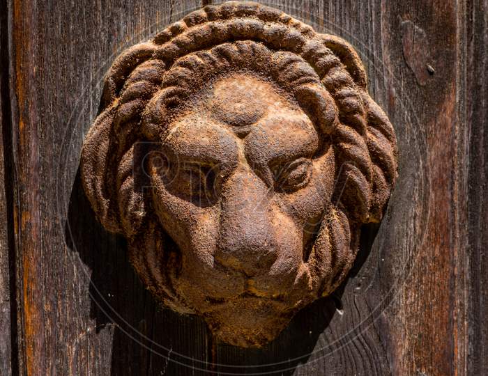 Italy, Venice, A Close Up Of A Wooden Door With A Lion