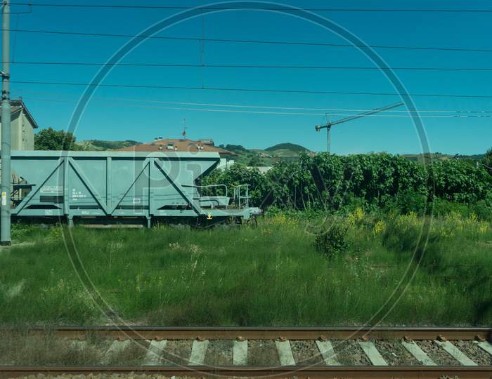 Italy - 28 June 2018: The Trenitalia In The Italian Outskirts Track