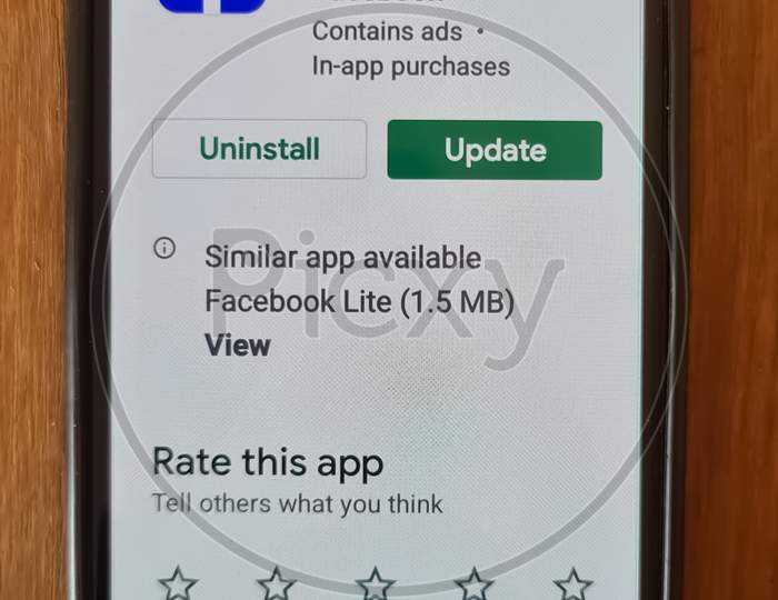 A smartphone screen updating Facebook application