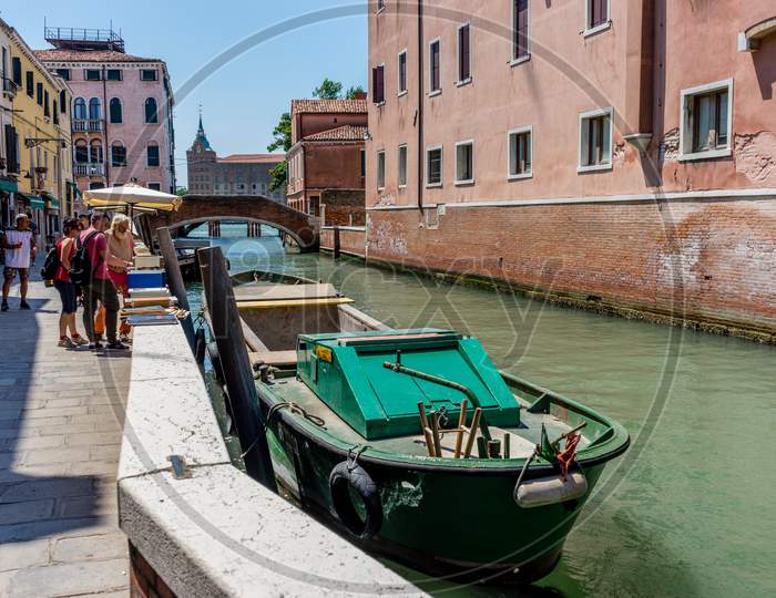 Venice, Italy - 01 July 2018: People Walking On Narrow Street In Venice, Italy