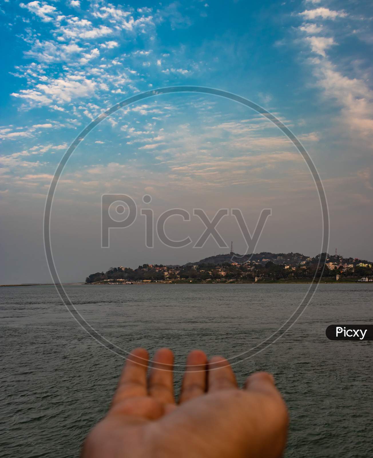 Girl Posing Her Hand Towards Island At Ship Deck With Sunset Orange Sky