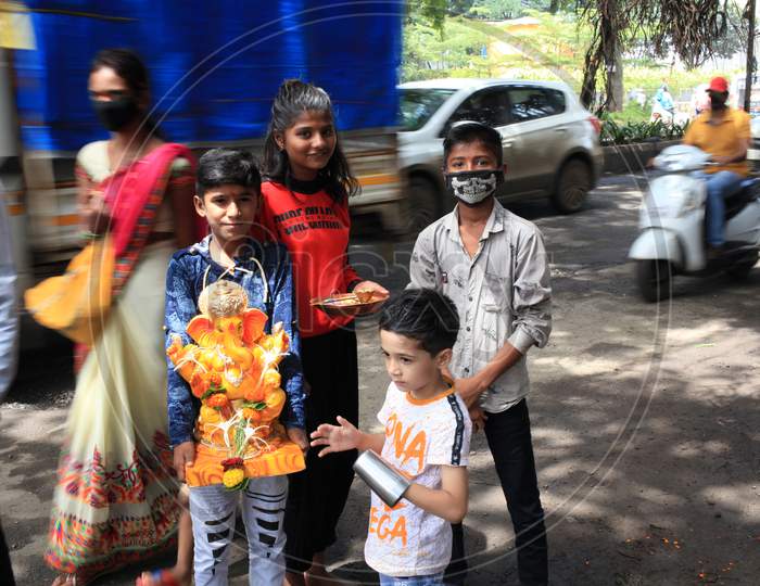 A Gang Of Children Taking Lord Ganesha To The Local Designated Tank For The Annual Immersion Ritual. This Marks The End To The 10 Day Ganpati Festival.