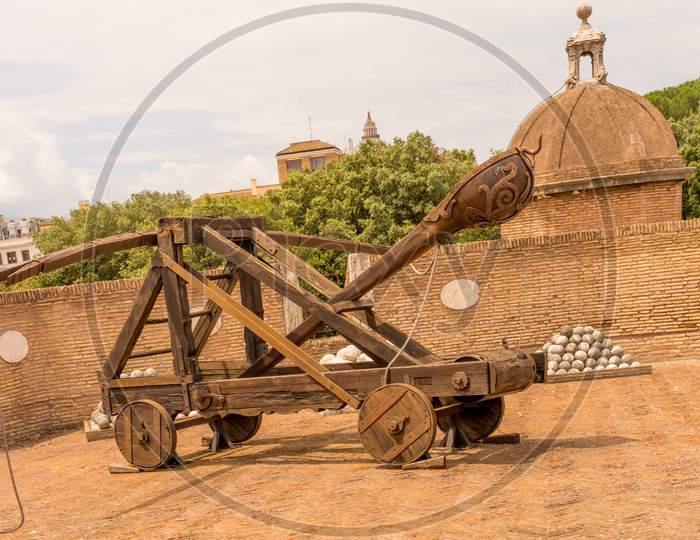 Rome, Italy - 23 June 2018: Ancient Catapult Weapon With Cannon Balls At The Castel Sant Angelo, Mausoleum Of Hadrian In Rome, Italy