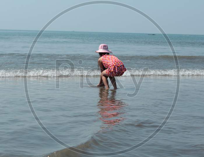 girl play with water  sea