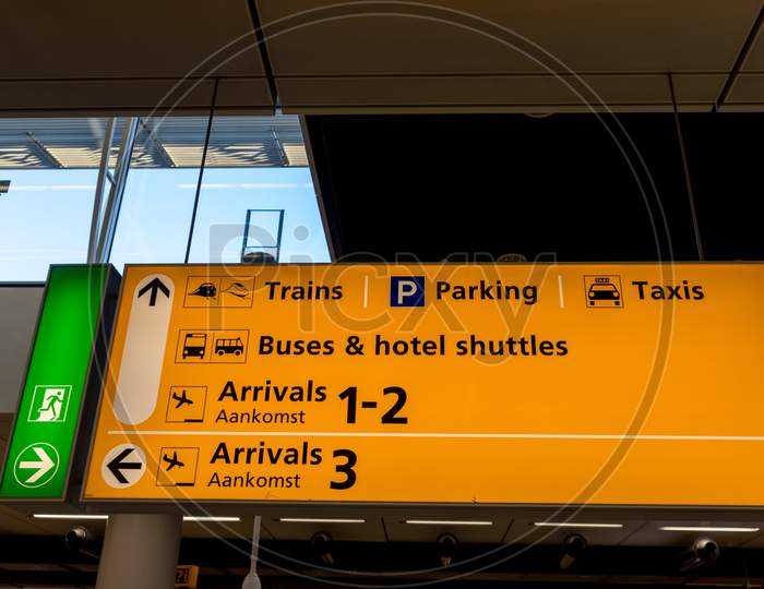 Netherlands, Amsterdam, Schiphol - 06 May, 2018:  Directions Inside The Airport Being Diaplayed For Passengers