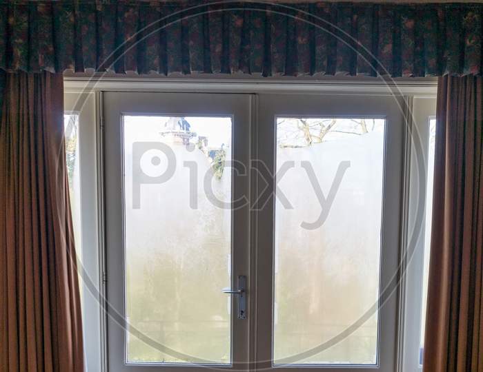 Belgium, Bruges, A Shower Curtain Next To A Window