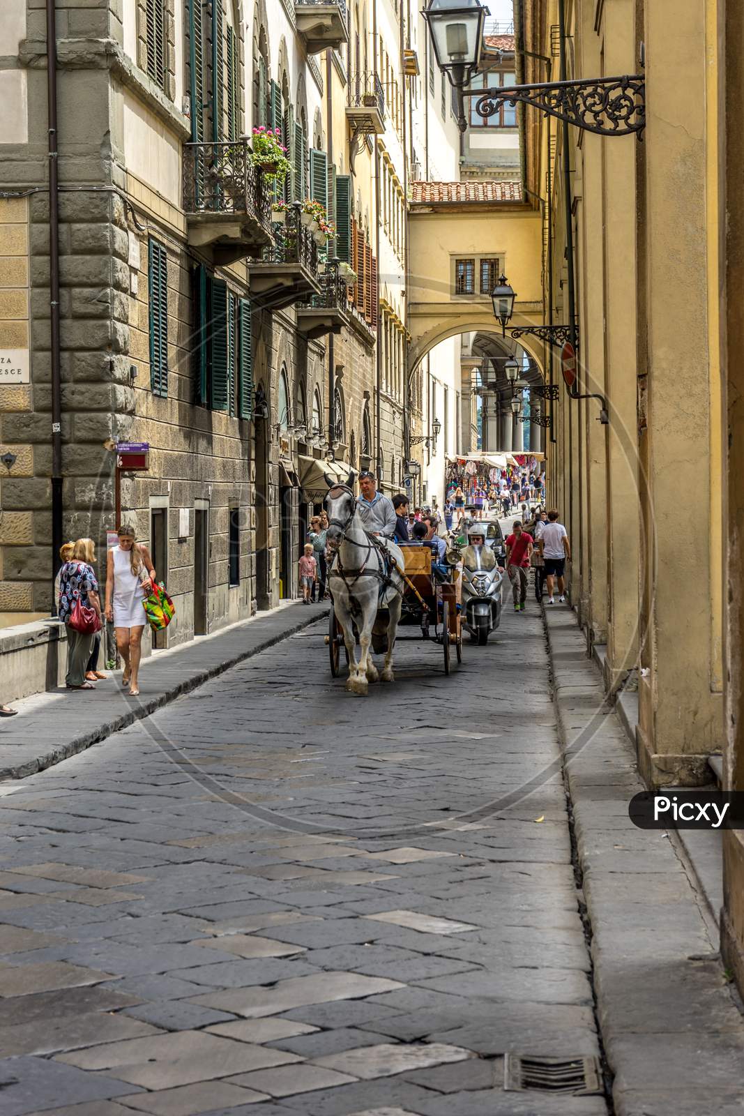 Florence, Italy - 25 June 2018: Horse Drawn Carts In The Narrow Cobblestone Street In Florence, Italy