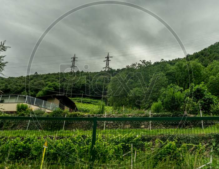 Italy,La Spezia To Kasltelruth Train, A Close Up Of A Lush Green Field Next To A Wire Fence