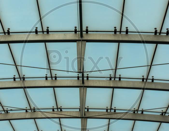 Netherlands, Amsterdam, Schiphol, A Large White Building With A Metal Frame