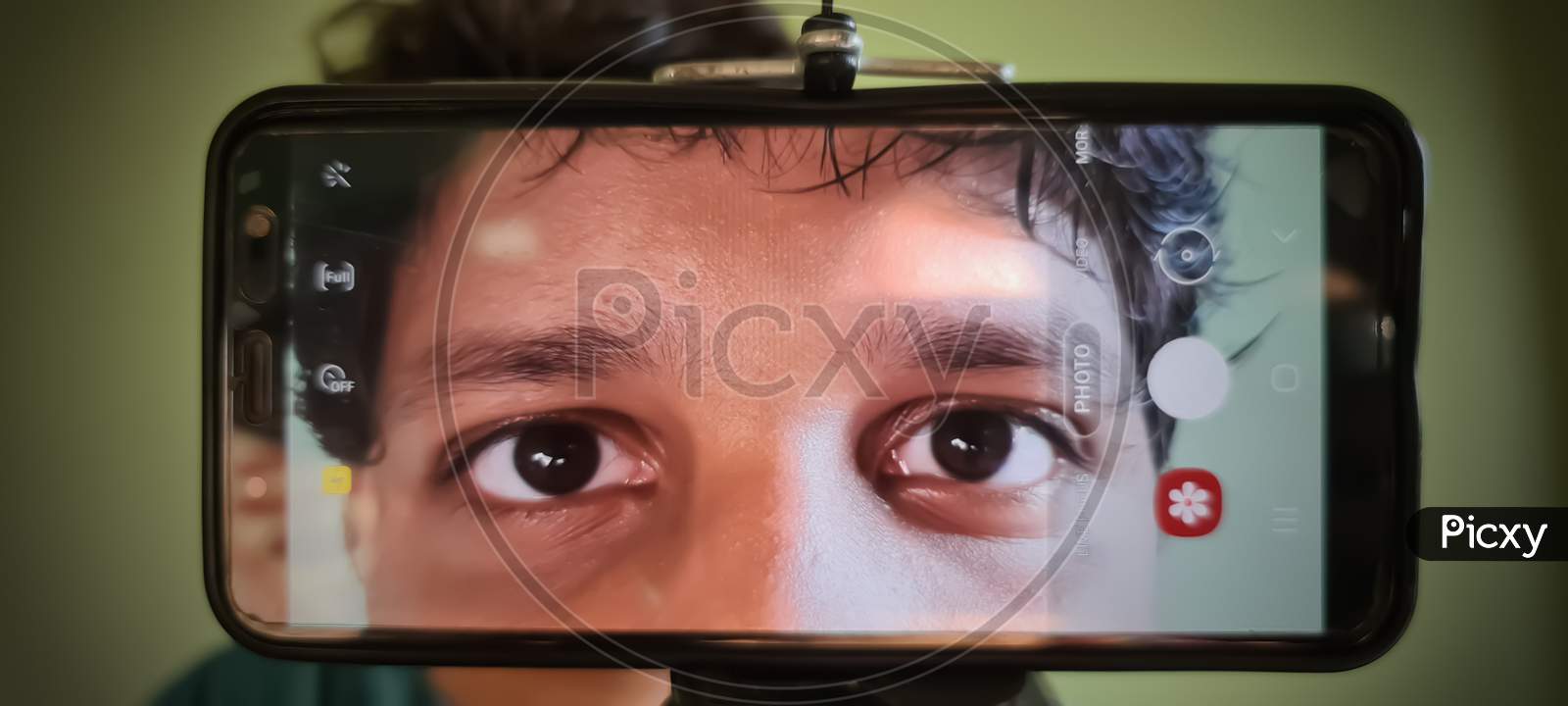 Human eyes in smartphone screen