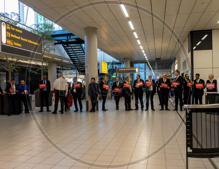 Netherlands, Amsterdam, Schiphol - 06 May, 2018:  Taxi Drivers Waiting To Pick Up People At The Airport