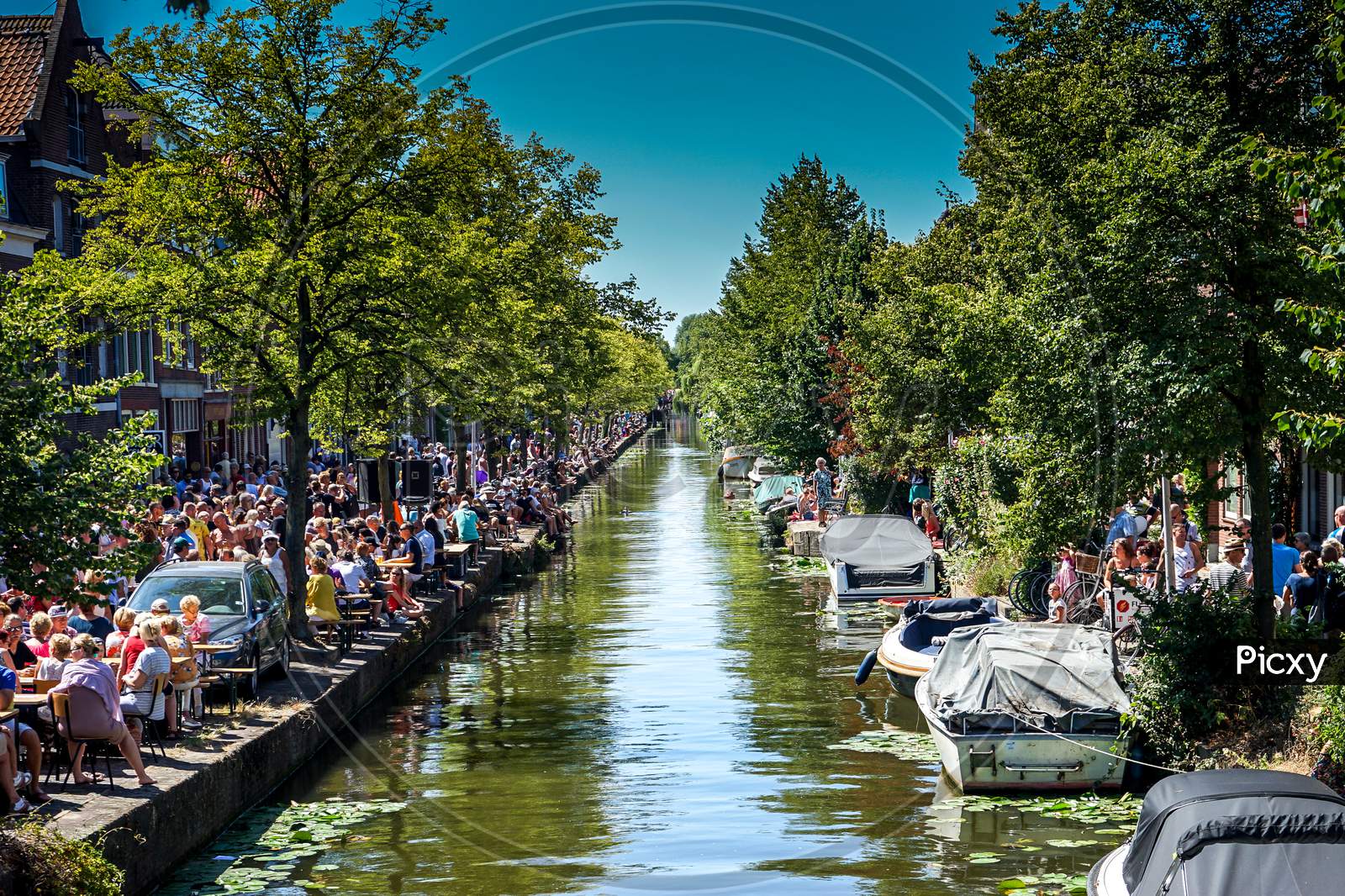 Netherlands, Delft - 5Th August 2018: A Group Of People On A Boat In The Water