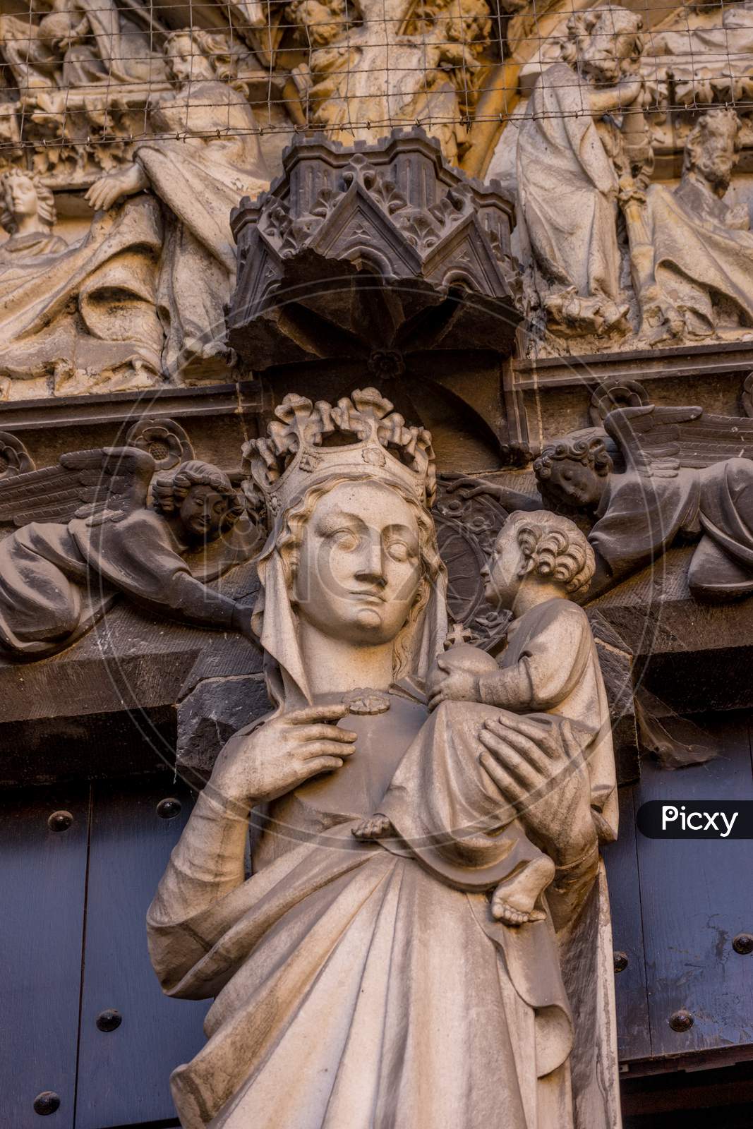Belgium, Bruges, A Statue Of A Madonna Holding Baby Jesus