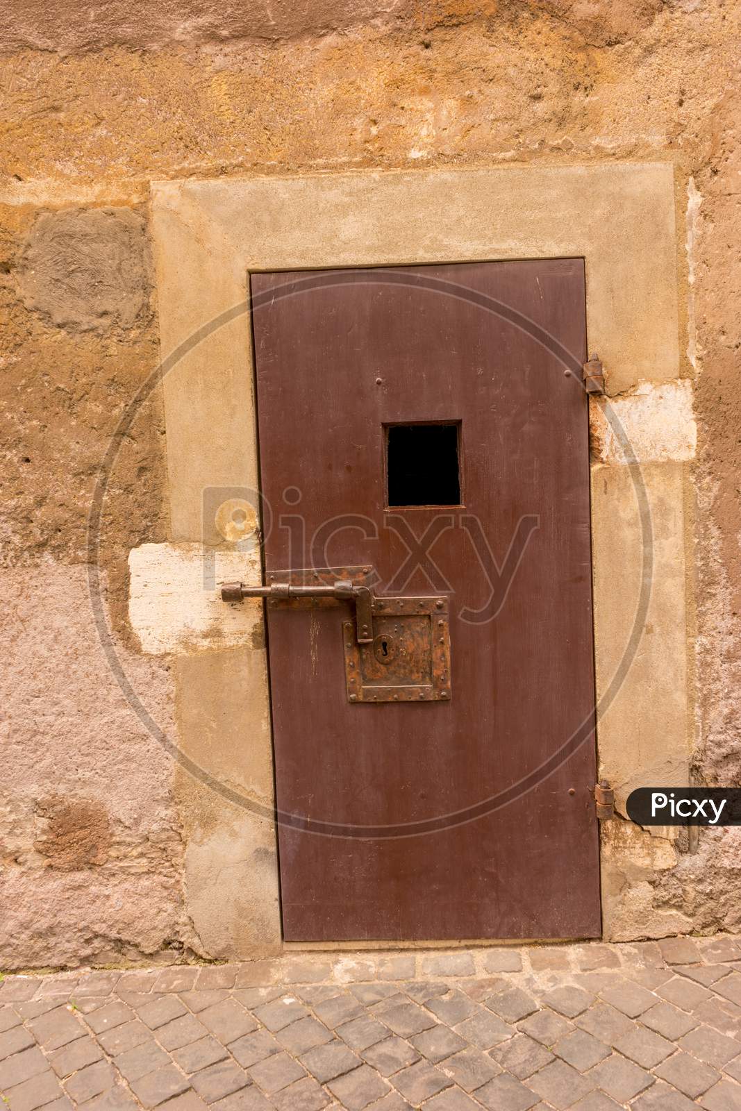 Door With A Square Hole And Latch