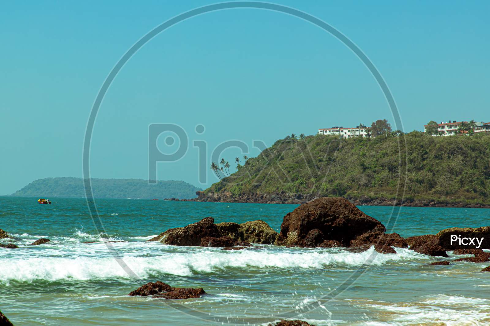 Landscape with ocean wave and rocks in goa india.