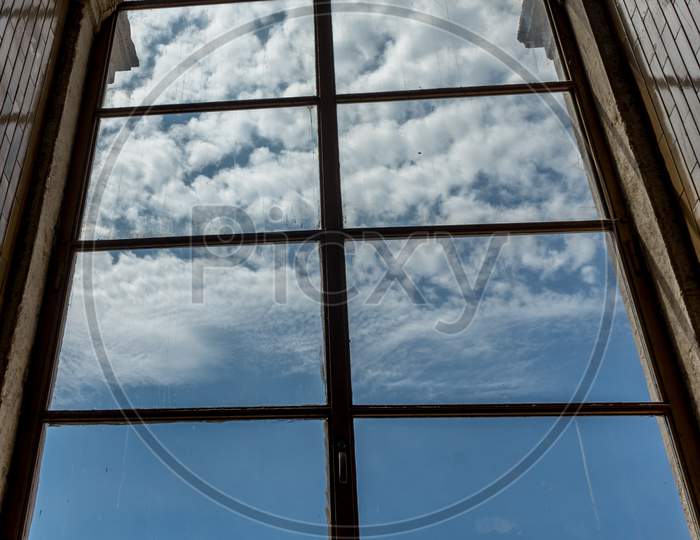 Blue Sky With Clouds Viewed Through French Window