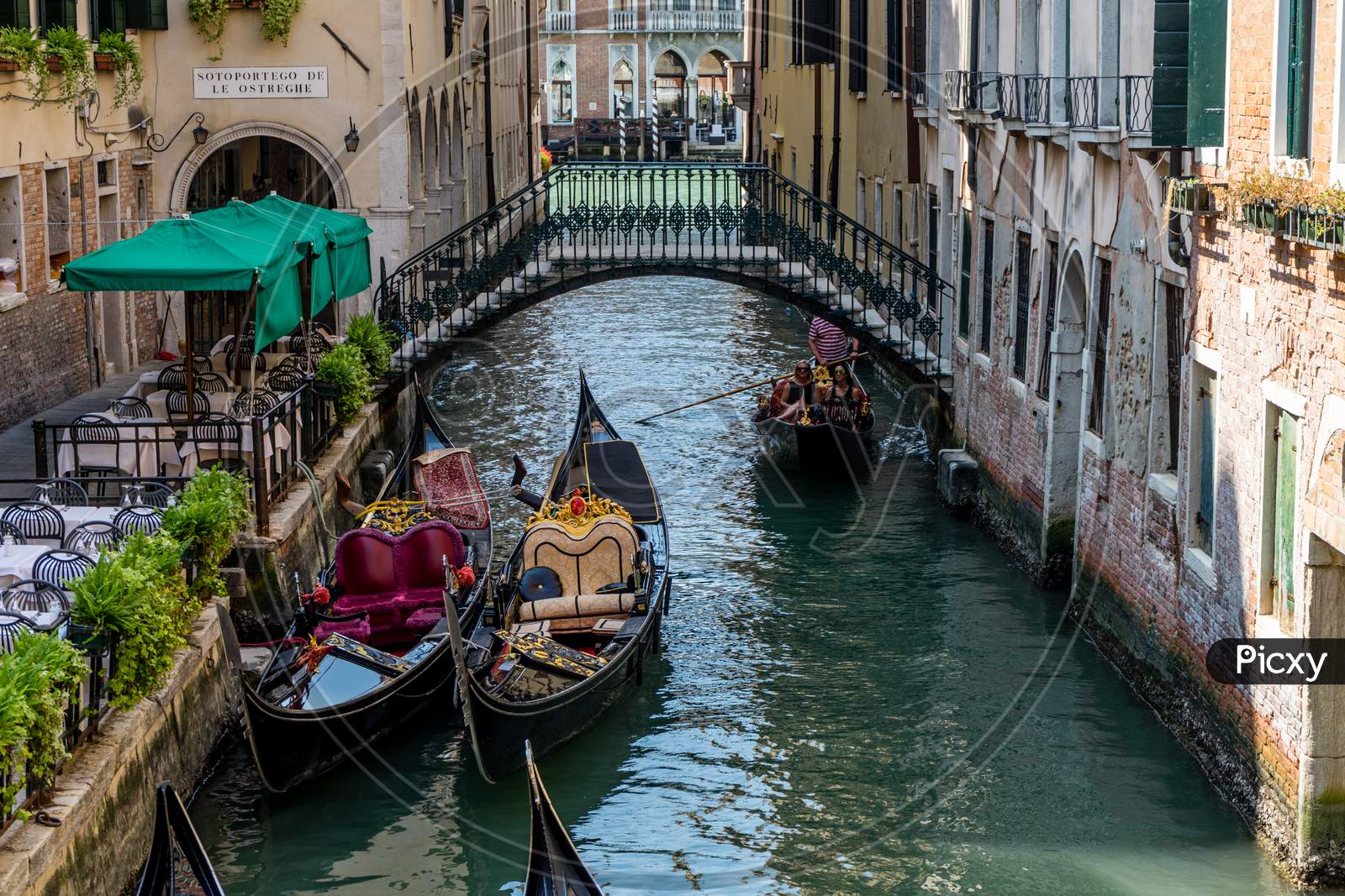 Venice, Italy - 01 July 2018: The Gondolas On A Canal In Venice, Italy
