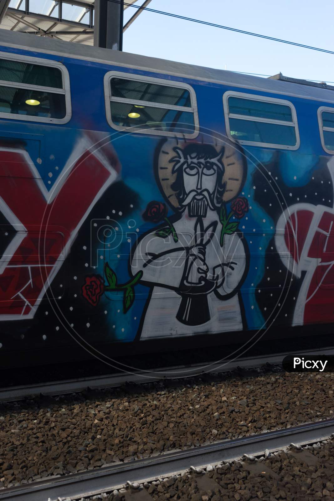 Italy - 28 June 2018: The Graffiti On Trenitalia In The Italian Outskirts Track
