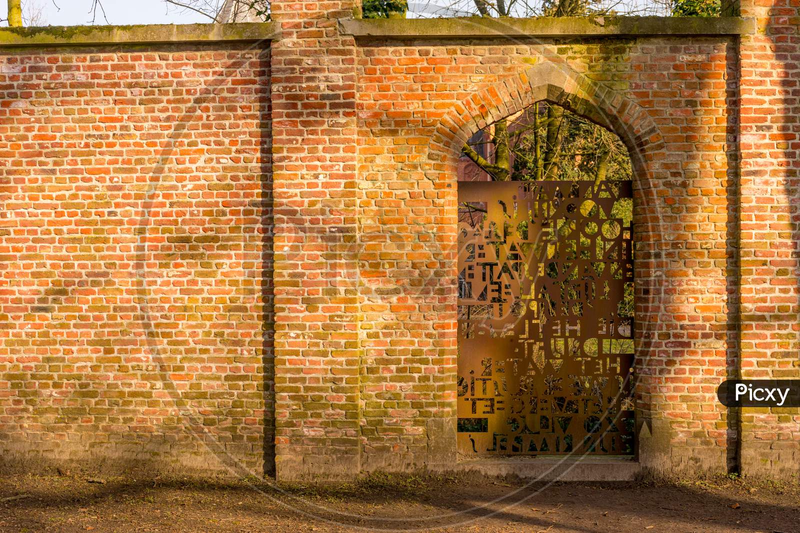 Belgium, Bruges, Steel Door With Red Brick Wall