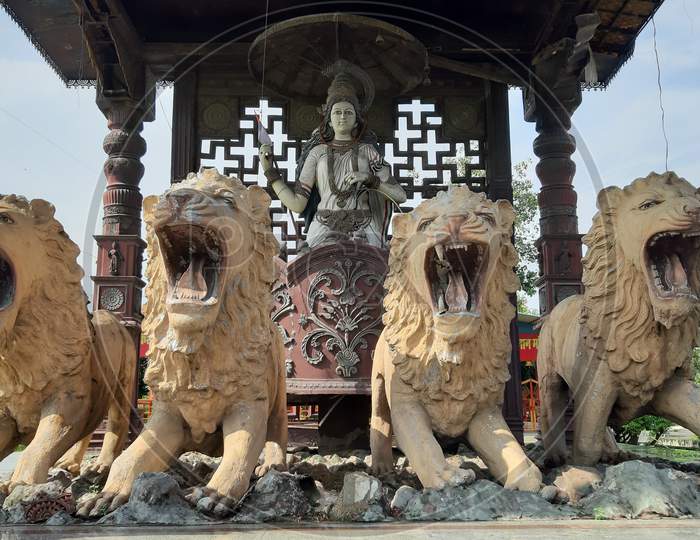 Durga maa on loins, old historical statue looking beautiful and attractive.