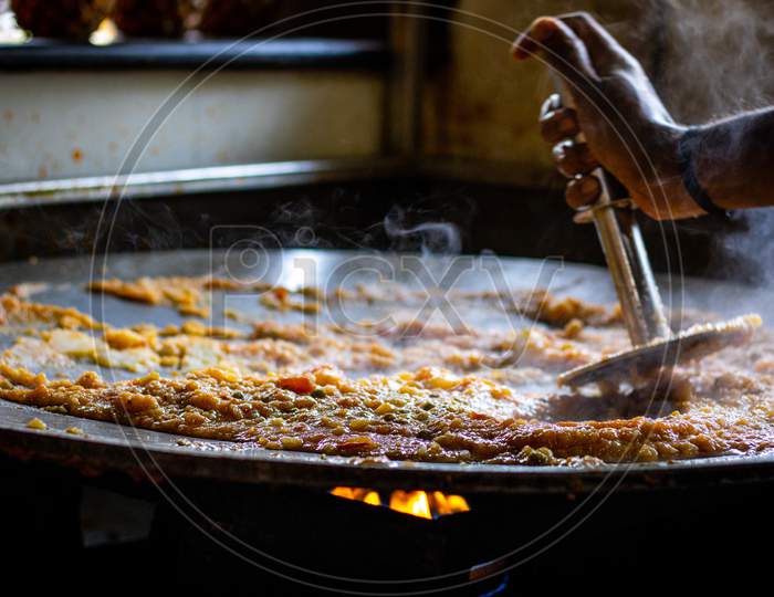 Indian pav bhaji cooking on tawa