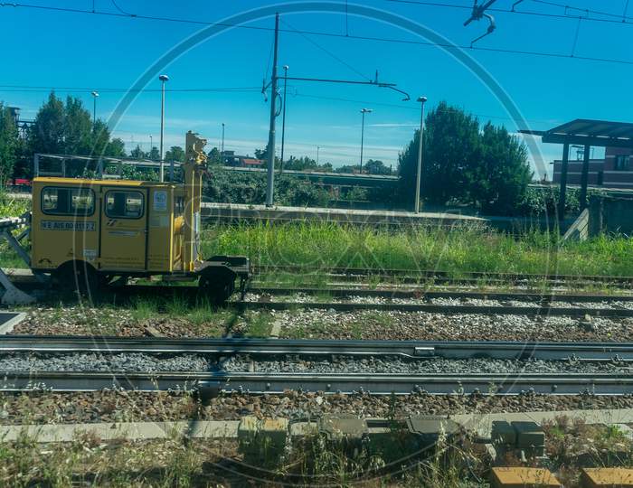 Italy - 28 June 2018: The Yellow Plasser And Theurer On Trenitalia In The Italian Outskirts Track